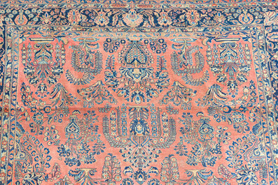 A Persian Sarouk rug with floral design, wool on cotton, first half 20th C.