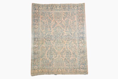 A Persian American Sarouk rug with floral design, wool on cotton, 20th C.