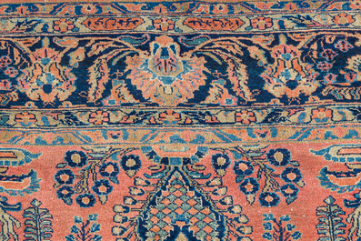 A Persian Sarouk rug with floral design, wool on cotton, first half 20th C.