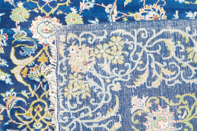 A Persian Keshan (Kashan) rug with floral design, wool on cotton, 20th C.