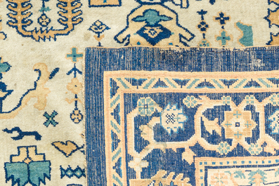 A Chinese wool carpet with floral geometric design, first quarter 20th C.