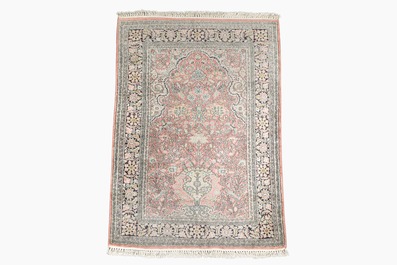 Three oriental silk rugs with hunting scenes and floral design, Hereke, Qom (Qum/Ghom) and Kashmir, 20th C.