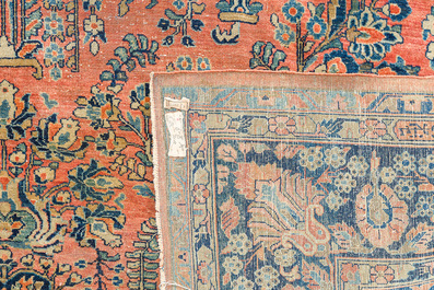 A Persian Sarouk rug with floral design, wool on cotton, first half 20th C.