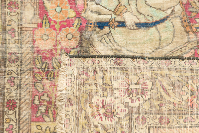 A Persian Kerman (Kirman) rug with figurative design and an Isfahan rug with floral design, wool on cotton, 20th C.