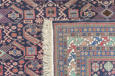 Four oriental rugs, a.o. a Persian Shirvan rug and an Azerbaijani runner with geometric design, wool on cotton, 20th C.