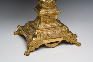 A large French gilt bronze monstrance decorated with cherubs amidst radiant clouds and set with glass stones, ca. 1900