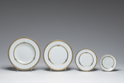 A French 50-piece polychrome and gilt porcelain 'Ruban or' service, Christofle, 20th C.