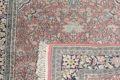 Three oriental silk rugs with hunting scenes and floral design, Hereke, Qom (Qum/Ghom) and Kashmir, 20th C.