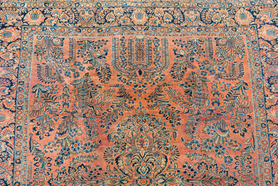 A Persian American Sarouk rug with floral design, wool on cotton, 20th C.