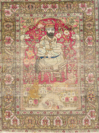 A Persian Kerman (Kirman) rug with figurative design and an Isfahan rug with floral design, wool on cotton, 20th C.
