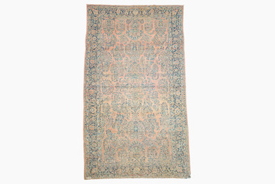 A Persian Sarouk rug with floral design, wool on cotton, first half 20th C.