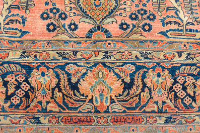 A Persian Sarouk rug with floral design, wool on cotton, first half 20th C.