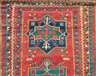 A Kazakh wool Fachralo rug with geometric and floral design, first half 20th C.