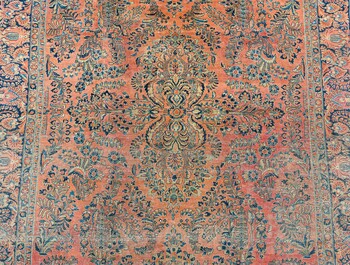 A Persian American Sarouk rug with floral design, wool on cotton, 20th C.