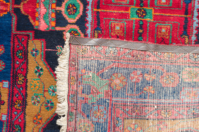 Four oriental rugs, a.o. Tabriz, Sarouk and Hamadan/Nahavand rugs with floral and geometric design, wool and cotton, 20th C.