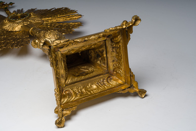 A large French gilt bronze monstrance decorated with cherubs amidst radiant clouds and set with glass stones, ca. 1900