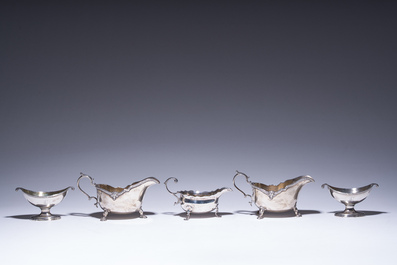 Three English silver sauce boats and a pair of 'armorial' salt cellars, 18th/20th C.