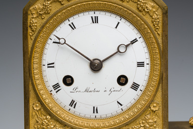 A Ghent gilt bronze mantel clock crowned with a male Bacchante, 19th C.