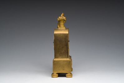 A Ghent gilt bronze mantel clock crowned with a male Bacchante, 19th C.