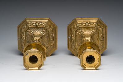 A pair of French gilt bronze R&eacute;gence style candlesticks with floral design, late 19th C.