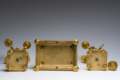 A French Louis XVI style gilt bronze and cut glass mantel clock accompanied by a pair of candlesticks, 19th/20th C.