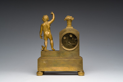 A Ghent gilt bronze mantel clock crowned with a male Bacchante, 19th C.