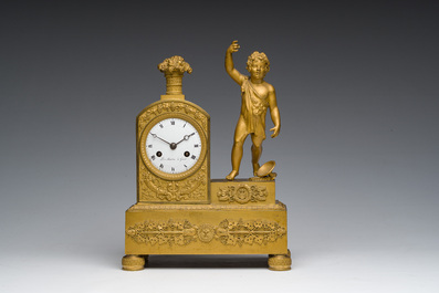 A Ghent gilt bronze mantel clock crowned with a male Bacchante, 19th C.