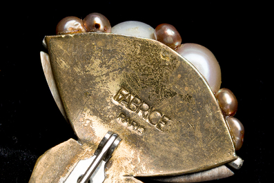 A varied collection of brass jewelry finished with a.o. mother-of-pearl, pearls and wood, marked 'Fabrice Paris', 20th C.