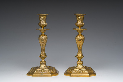 A pair of French gilt bronze R&eacute;gence style candlesticks with floral design, late 19th C.