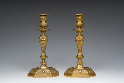 A pair of French gilt bronze R&eacute;gence style candlesticks with floral design, late 19th C.