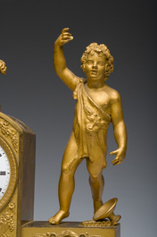 A Ghent gilt bronze mantel clock crowned with a male Bacchante, 19th C.