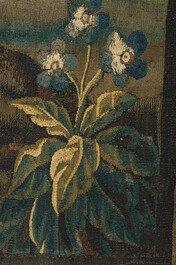 A Flemish wall tapestry with a pheasant in a landscape, 17th C.