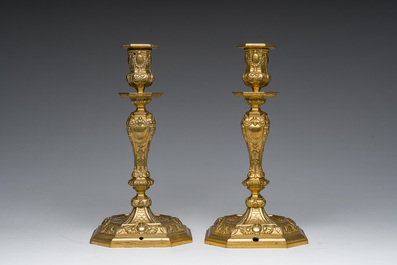 A pair of French gilt bronze R&eacute;gence style candlesticks with floral design, late 19th C.