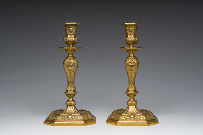 A pair of French gilt bronze R&eacute;gence style candlesticks with floral design, late 19th C.