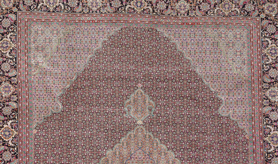 A Persian Bidjar rug with floral design, wool, cotton and silk, 20th C.