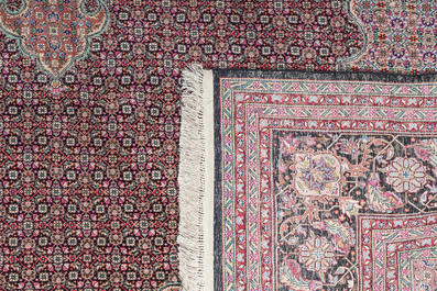A Persian Bidjar rug with floral design, wool, cotton and silk, 20th C.
