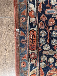 A Persian Sarouk rug with floral design, wool on cotton, first half 20th C.