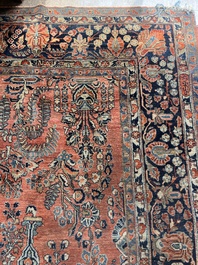 A Persian Sarouk rug with floral design, wool on cotton, first half 20th C.