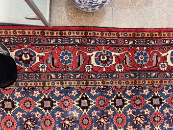 A Persian Varamin rug with floral design, wool on cotton, mid 20th C.
