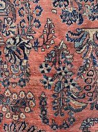 A Persian Sarouk rug with floral design, wool on cotton, first half 20th C.