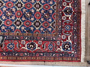 A Persian Varamin rug with floral design, wool on cotton, mid 20th C.