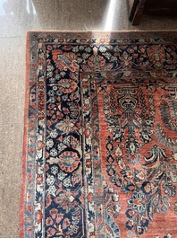 A Persian Sarouk rug with floral design, wool on cotton, first half 20th C.