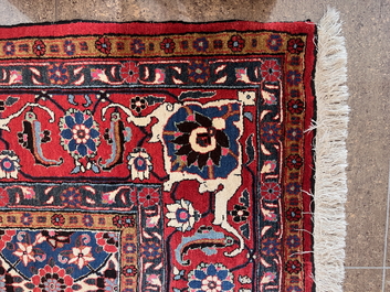 A Persian Varamin rug with floral design, wool on cotton, mid 20th C.