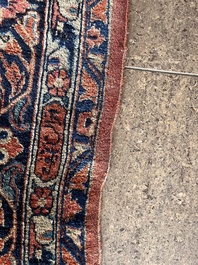 A Persian Sarouk rug with floral design, wool on cotton, first half 20th C.