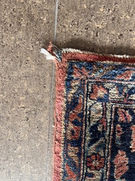 A Persian Sarouk rug with floral design, wool on cotton, first half 20th C.