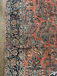 A Persian Sarouk rug with floral design, wool on cotton, first half 20th C.