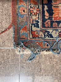 A Persian Sarouk rug with floral design, wool on cotton, first half 20th C.