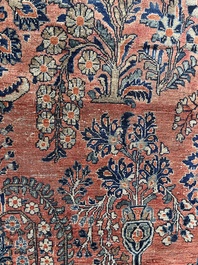 A Persian Sarouk rug with floral design, wool on cotton, first half 20th C.