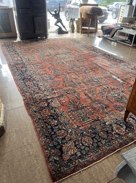 A Persian Sarouk rug with floral design, wool on cotton, first half 20th C.
