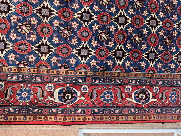 A Persian Varamin rug with floral design, wool on cotton, mid 20th C.